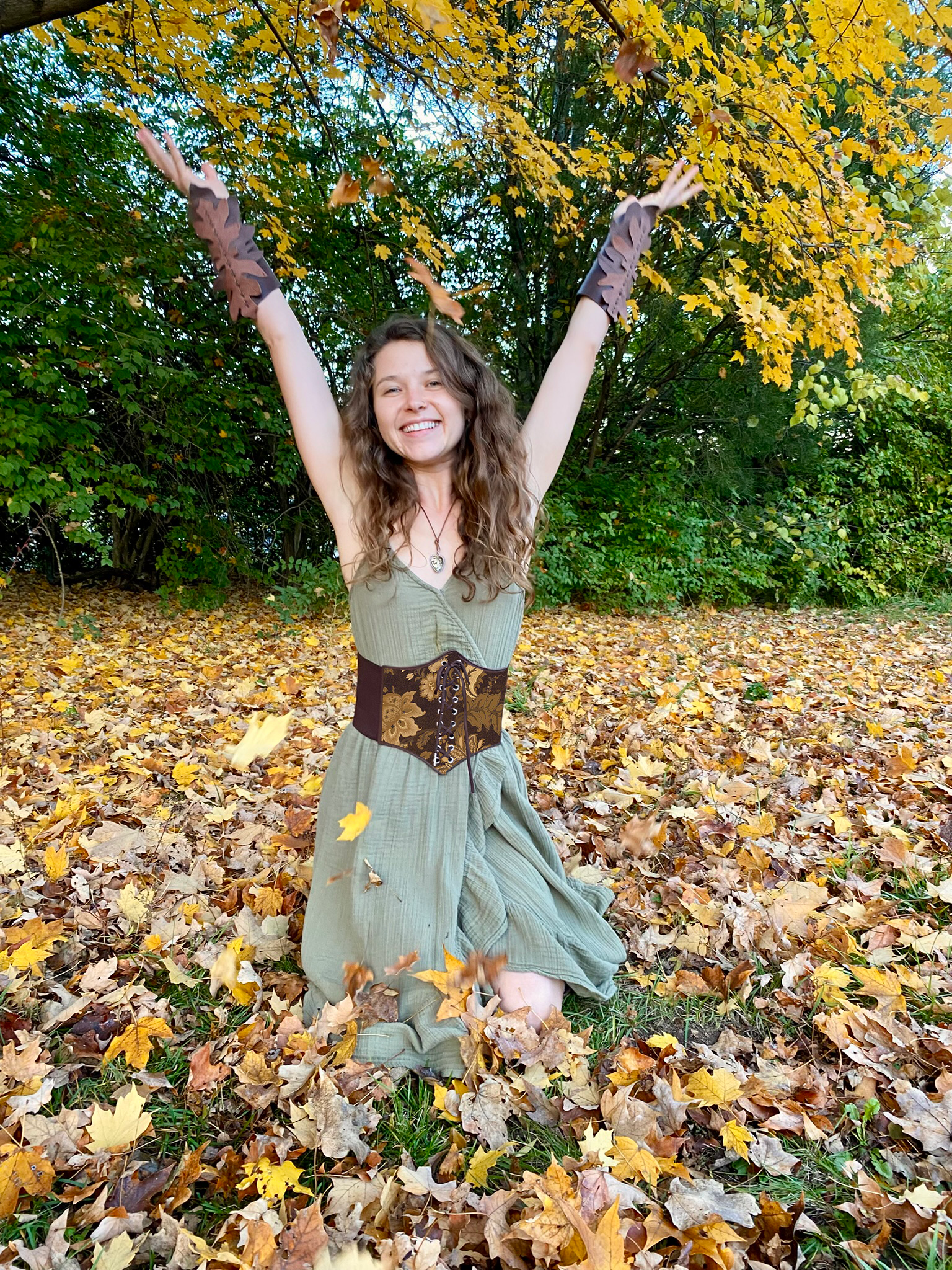 Erika tossing autumn leaves